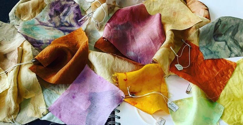 Array of naturally dyed fabric samples in earthy colours used by the artist Kate Turnbull